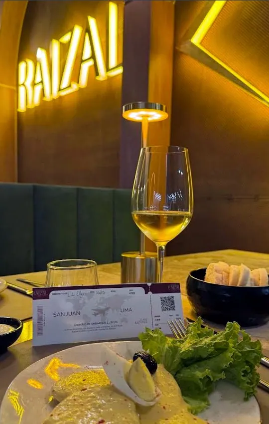 A table at Raizal with wine and house dishes
